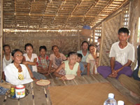 villagers gather for a worship service