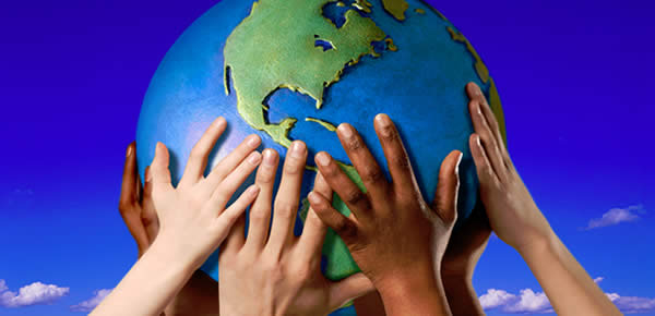 Children hands on a globe